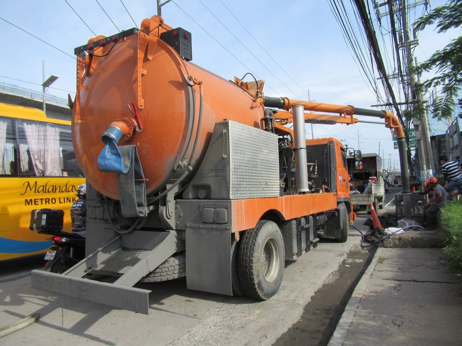 Vacuum truck set up for a sewer job